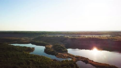 Aerial View of Lakes and Forest at Sunrise