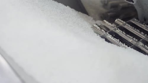 Close-up of White Plastic Pellets in an Industrial Setting