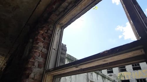 Broken window in abandoned scary place - close up - urban exploration (slow motion)