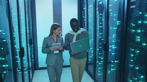 Technicians Working in Modern Data Center Server Room