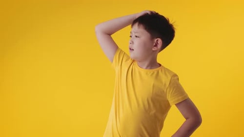 Child Scratching Head with Contemplative Expression