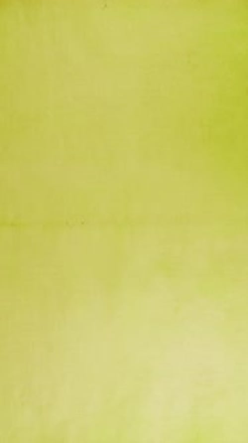 Stop motion of handmade recycled paper sheets in warm yellow, green, pink, peach, blush and mustard