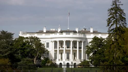 Zoomed-In White House Flag with Fall Foliage in DC