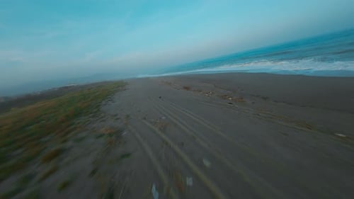 Drone Footage of Waves Crashing on Sandy Beach