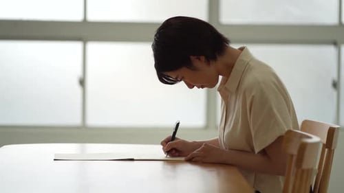 A woman practicing ballpoint pen