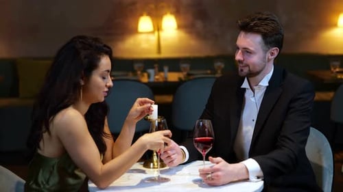 Happy Couple Talking While Holding Hands Sitting in the Restaurant Romantic Dinner Lifestyle Love