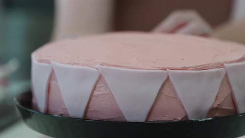 Decorating a Pink Cake with Fondant Triangles
