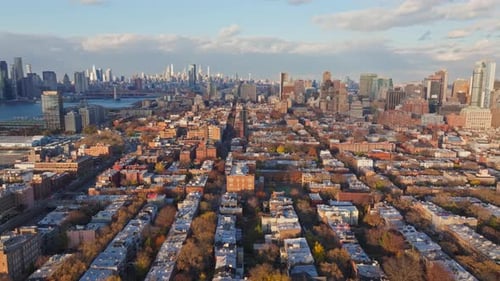 Aerial View of Williamsburg Residential Street in Brooklyn Revealing Distant Manhattan Skyline