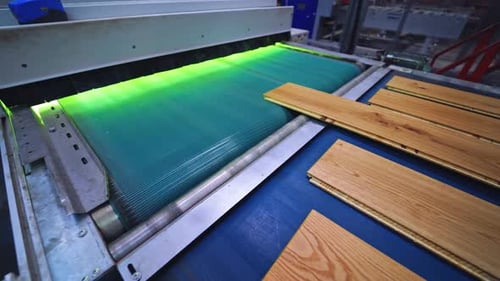 Interior of furniture factory. Production line of parquet board.