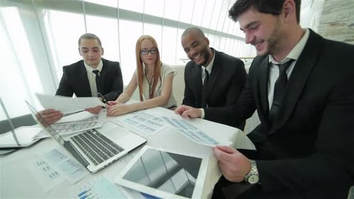 Business Professionals Collaborating on Project in Bright Office