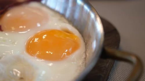 Cooking Sunny Side Up Eggs in a Vibrant Kitchen Environment