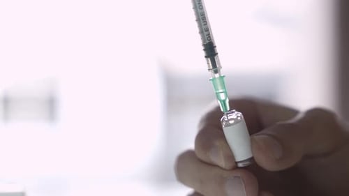Drawing Medicine from Vial Using Needle and Syringe