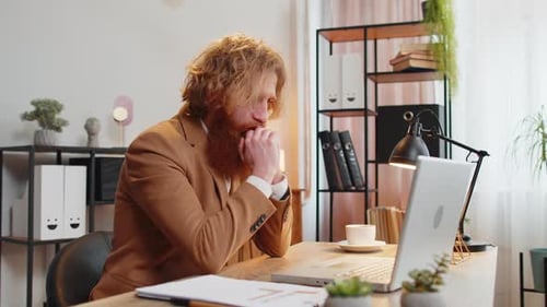 Sad Businessman Using Laptop Typing Browsing Loses Bad News Fortune Loss Fails at Home Office Desk