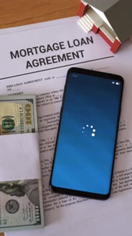 Mortgage loan approved notification. Concept of getting in debt to buy real estate. Vertical shot.