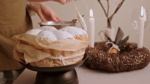 Woman Icing Traditional Easter Cake for Festive Holiday