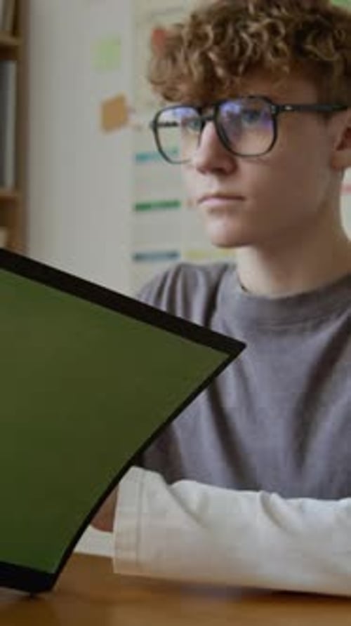 Vertical of Teenage Schoolboy Reading Health Education Textbook at Lesson