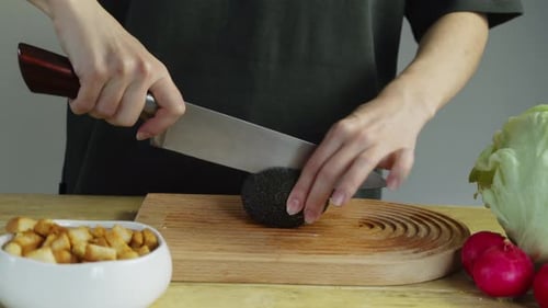 Housewife Carefully Cut the Surface of the Avocado with the Peel to Then Remove the Stone From the