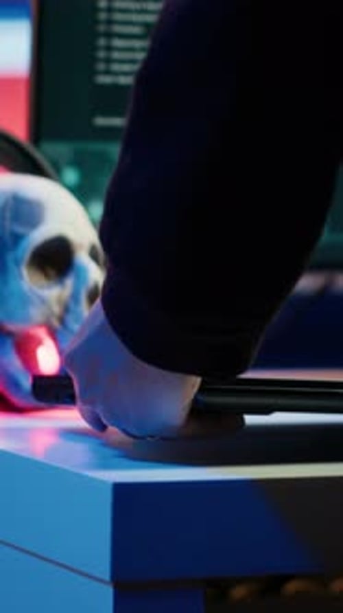 Vertical Video Hooded Hacker Taking Laptop Out of Suitcase Prepared to Launch DDoS Attack