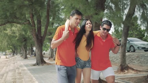A group of male volunteers helping injured tourists while touring the beach