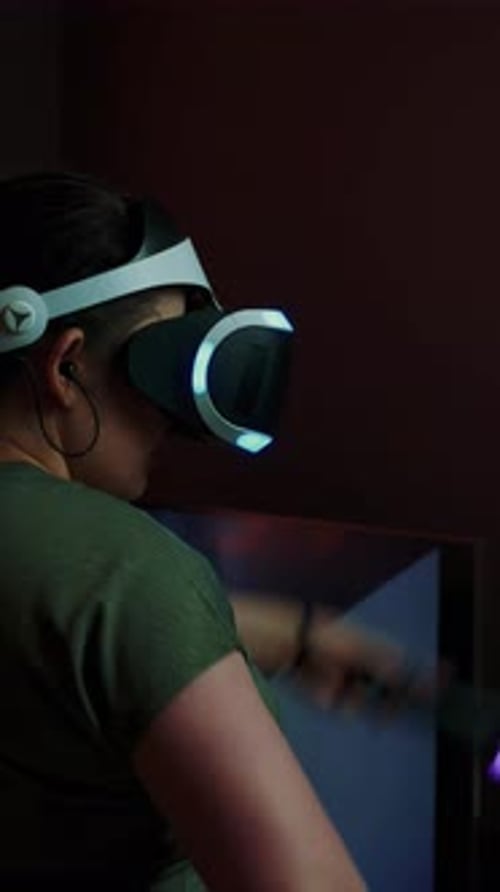 Woman Playing Virtual Reality Game at Home