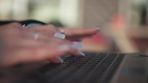 CloseUp of Hands Typing on Laptop Keyboard with Focused Typing Action ...