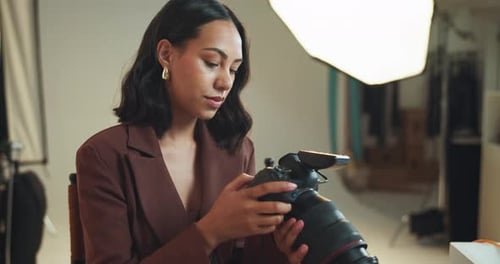 Woman, photographer and check on camera in studio of photoshoot results, editing and catalog