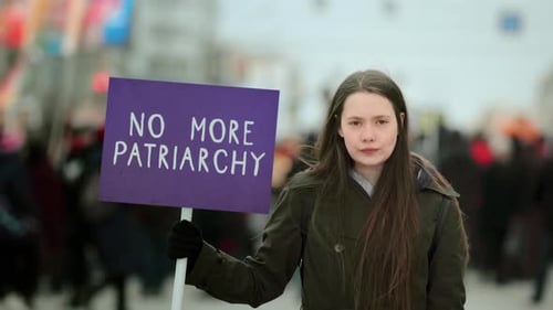 Young Adult Protesting Patriarchy in Urban Environment