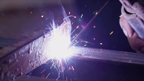 Welding Metal Bars Close Up with Sparks