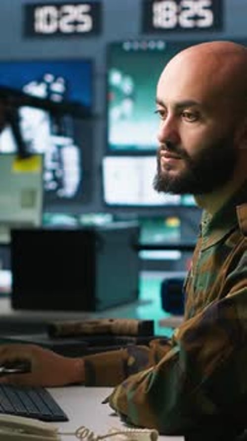 Vertical Video Man Looking at Screens in Military HQ Base Intercepting Ballistic Rockets