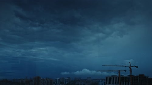 Timelapse of a Rainy Sky with Low Altitude Clouds Running Over the City