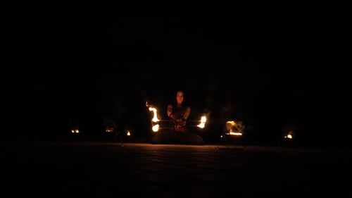 A Professional Artist Demonstrates Various Fire Tricks A Fire Show