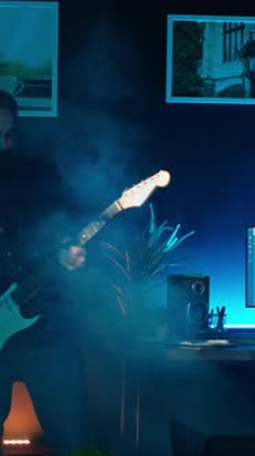 Vertical Video Playful Internet Star Playing Guitar in Studio