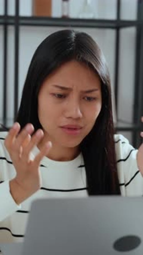 Woman participates in a remote video conference call