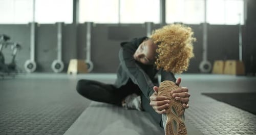 Woman, exercise or stretching legs in gym for fitness for body health, strength training