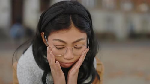 Woman With Glasses Thinking Outside