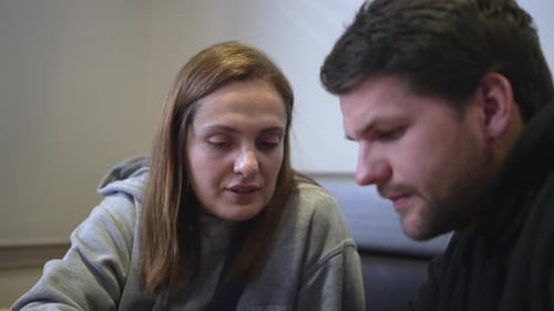 Caucasian Couple having a conversation at a coffee place