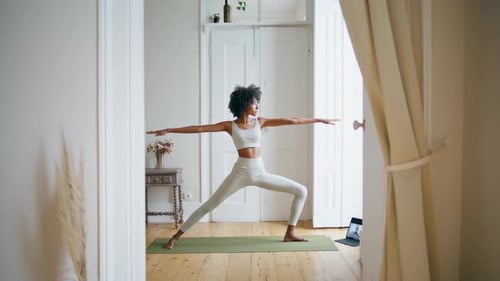 Woman Doing Yoga at Home in Natural Light