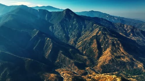 Californian rocky landscape on sunny morning. Drone footage above the rocks with poor vegetation on.