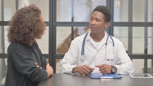 Doctor Talking to Patient in a Modern Office