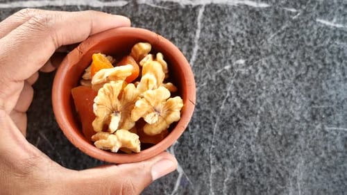 Walnut on a Plate on Table