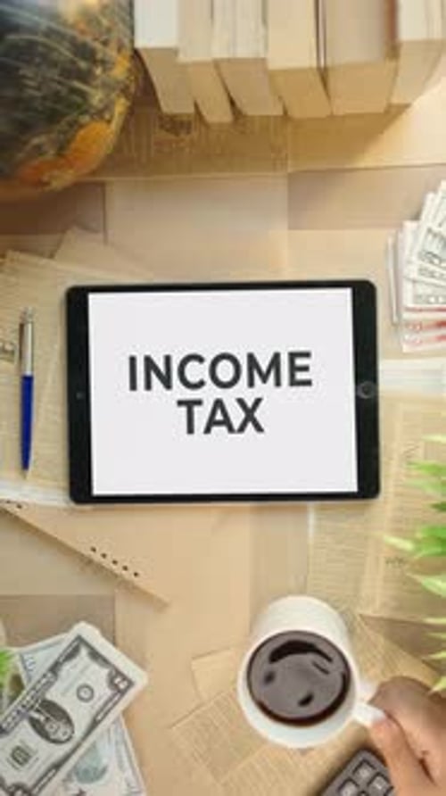 VERTICAL VIDEO OF INCOME TAX DISPLAYING ON FINANCE TABLET SCREEN