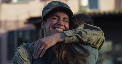 Soldier Hugs Child in Joyful Reunion