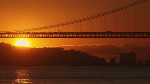 Sunset Behind Water and Bridge