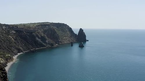 Top view of beautiful mountain coast with clear sky and horizon