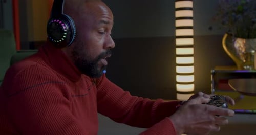 Excited Man Plays Video Game With Headset