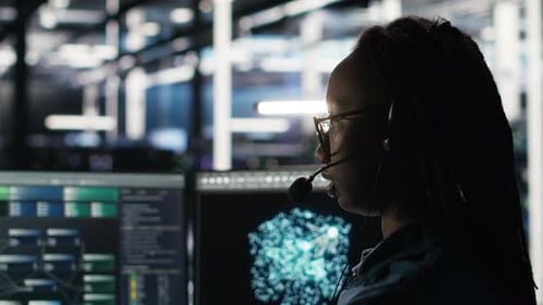 Data Center Employee Uses Audio Headset to Troubleshoot Client Reported Issues