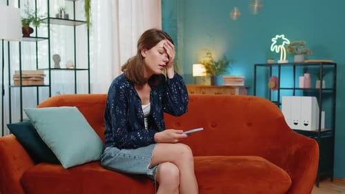 Frustrated Young Adult Woman Using Mobile Phone