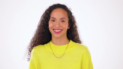 Portrait, happy and funny with a black woman laughing in studio on a gray background for humor