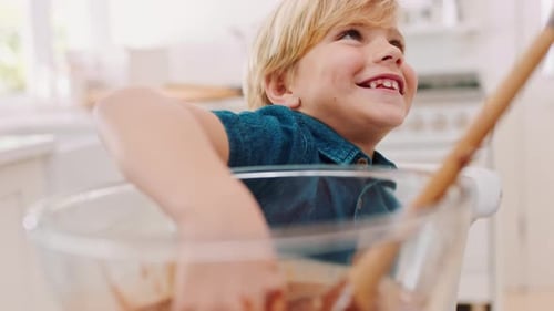 Child Enjoys Baking Chocolate Treats in the Kitchen