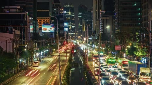 timelapse Vibrant Night Cityscape with Traffic Overflow in Urban Environment